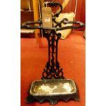 A Victorian black painted floral pierced cast iron stickstand, w.40cm