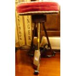 A Victorian brass and wrought iron music stool, having a re-upholstered rise-and-fall seat