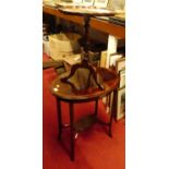 An Edwardian mahogany oval two-tier occasional table; together with a pedestal wine table (2)