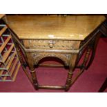 A contemporary Ipswich joined and relief carved oak single drawer credence table, with arched