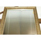 Reproduction gilt composition framed and bevelled rectangular wall mirror, 104x74cm