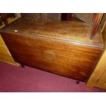 An early 19th century mahogany drop leaf dining table