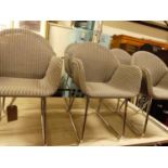 A set of six contemporary grey painted wicker conservatory elbow chairs, each raised on chromed