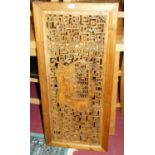 A Chinese carved and stained pine wall panel, decorated with figures within Greek Key surround, 45 x