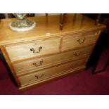 An Edwardian ash low squarefront chest, of two short over two long drawers, w.108cm