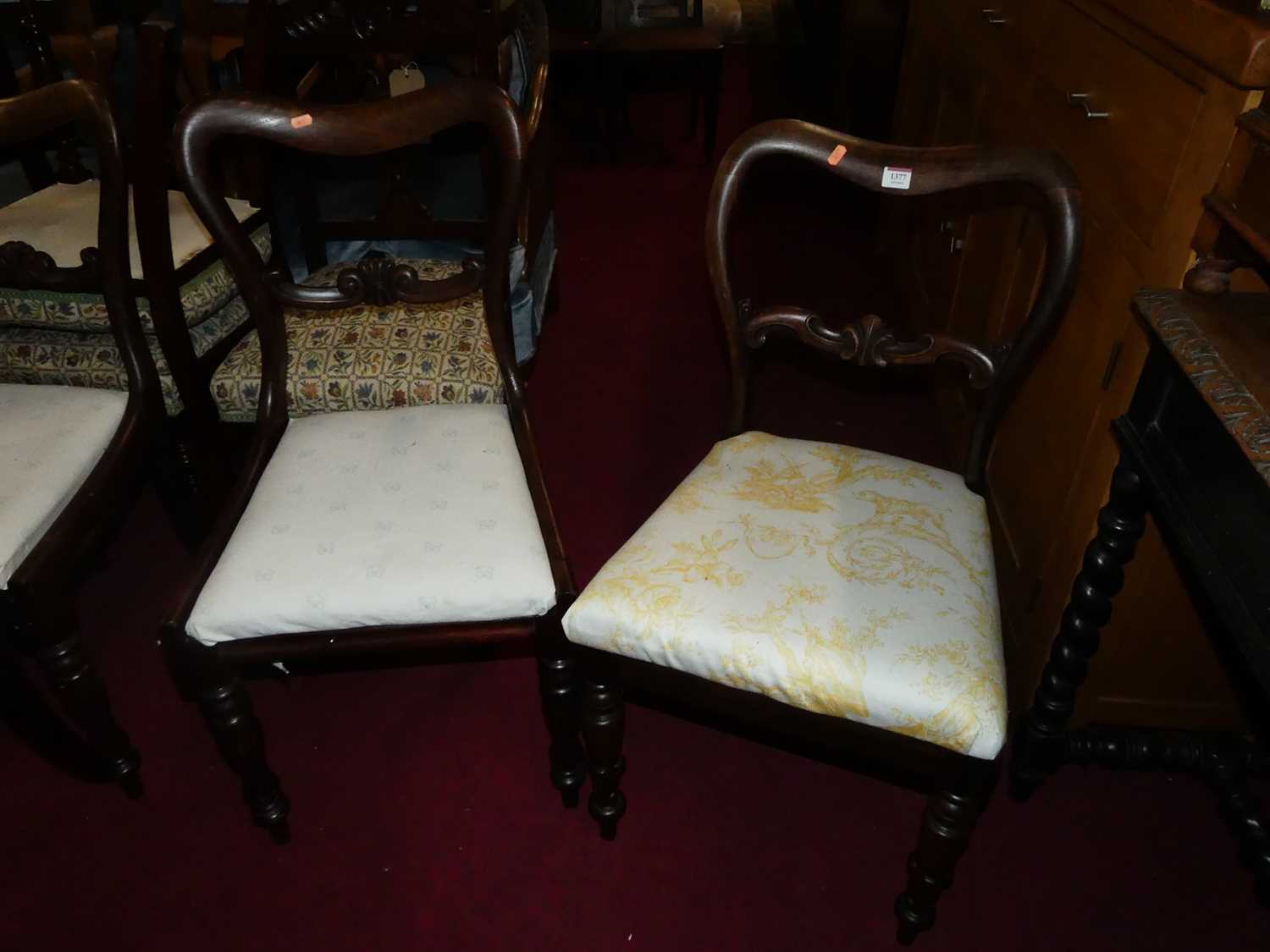 A pair of Victorian rosewood balloon back chairs, together with a similar further pair (4)