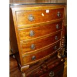 An early 20th century mahogany bowfront chest of four long drawers, on squat cabriole supports,