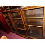 A circa 1900 mahogany and crossbanded breakfront open bookshelf, having adjustable shelves, w.183cm
