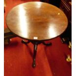 An early 19th century mahogany circular tilt-top pedestal tripod table, dia.69.5cm