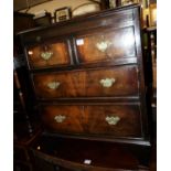 A small walnut chest of two short over two long drawers, having upper brushing slide, in the