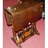 An early 20th century oak drop flap occasional table, having bobbin turned gateleg action, width