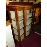 An Edwardian mahogany and chequer strung ledgeback bowfront single door glazed china display