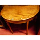 A mahogany demi-lune side table, with crossbanded top, w.106cm