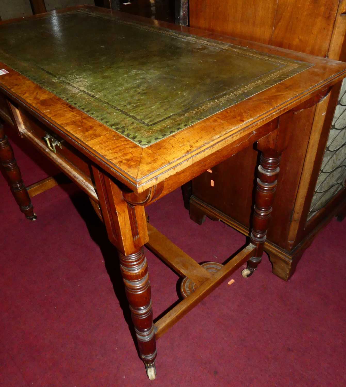 A Victorian Aesthetic Movement oak and burr oak two drawer writing table, having a gilt tooled green - Image 4 of 5