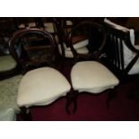 A set of four Victorian mahogany balloon back salon side chairs, together with a further similar