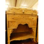 A circa 1900 French faded mahogany cylinder bureau, having a three-quarter spindle turned gallery