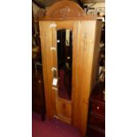 An Edwardian satin walnut narrow single mirror door wardrobe, width 77.5cm