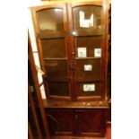 A stained pine and metal bound side cupboard, w.90cm