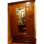 An Edwardian mahogany and chequer strung single mirror door wardrobe, with single long lower drawer,