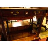 A 19th century provincial oak two drawer side table, raised on square supports, w.94cm