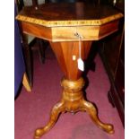 A mid-Victorian figured walnut and inlaid octagonal hinge-top sewing table