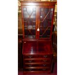 A reproduction yew wood bureau bookcase, having twin astragal glazed upper doors, w.84.5cm