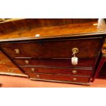 An early 19th century mahogany secretaire chest, the upper fitted drawer over three further long