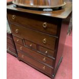 Stag Minstrel bedroom furniture to include; a chest of three short and four long drawers, width