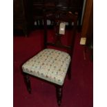 A set of three Edwardian walnut dining chairs, with floral needlework upholstered stuff over seats