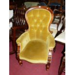 A mid-Victorian mahogany and dralon buttoned upholstered gentleman's showframe armchair, on turned