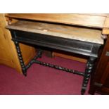An early 20th century ebonised and relief carved oak barley twist turned side, table 91cm