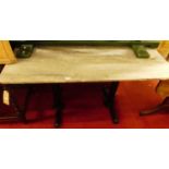 A variegated marble topped and painted metal based cafe table, length 120cm