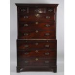 A George III mahogany chest-on-chest, the upper section having blind carved canted corners