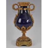 A mid-19th century gilt metal and porcelain pedestal vase, the pear shaped cobalt blue glazed