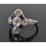 An Art Deco white metal, sapphire and diamond navette shaped cluster ring, comprising five Old