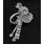 An Art Deco white metal diamond swag and bow brooch, featuring 33 round brilliant cut and 79