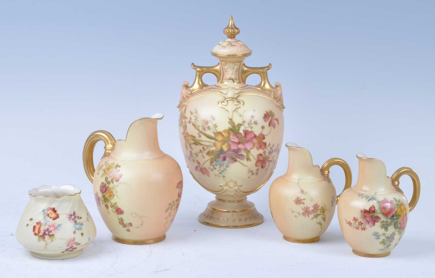 A collection of Royal Worcester blush ivory porcelain, to include a circa 1897 urn, decorated with