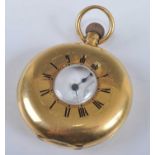 An early 20th century Swiss gent's 18ct gold cased half hunter pocket watch, having a white enamel