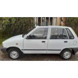 A 1989 Suzuki Alto five-door hatchback 796cc automatic Chassis No. JSAECB91S00203705 Engine No.