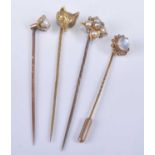 Four yellow metal stick pins, being a yellow metal quatrefoil pearl cluster featuring four 3.5mm