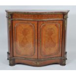 A continental walnut, kingwood and marquetry inlaid marble topped side cabinet, having gilt metal