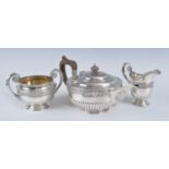 A Mappin & Webb three-piece silver tea service, comprising teapot, sugar and cream, each of half-