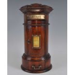 A Victorian style mahogany pillar-box, of cylindrical form with base drawer, h.42cm