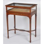 A Sheraton Revival satinwood and polychrome decorated bijouterie table, having a hinged glazed