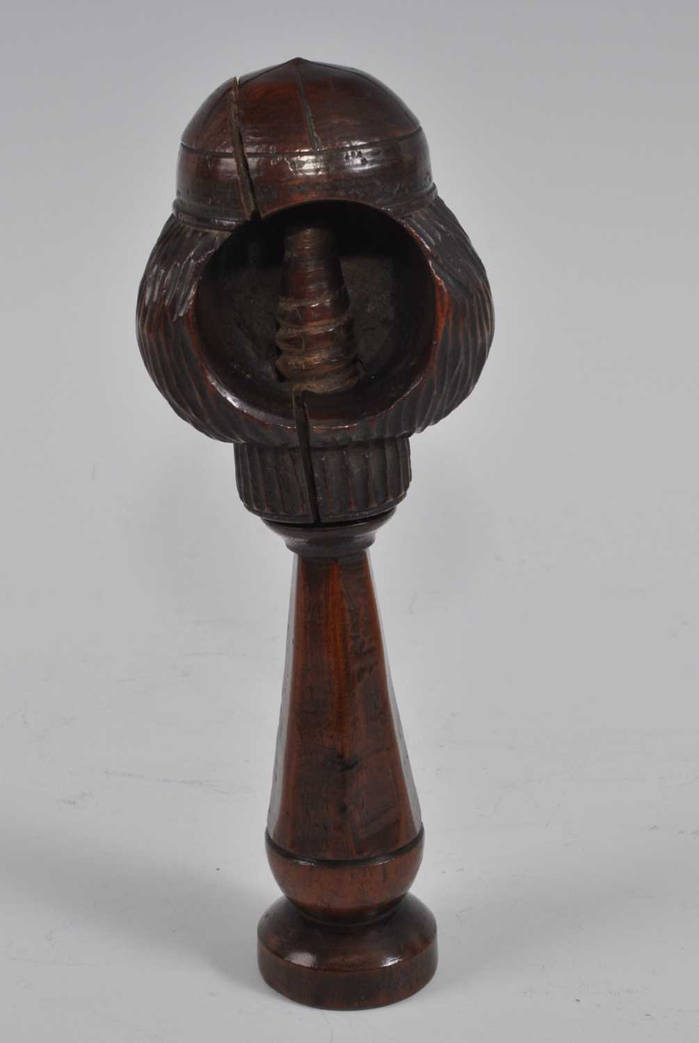 A 19th century treen figurative nutcracker, the head as a smiling man wearing a cap, the tapered - Bild 4 aus 5