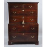 An antique joined oak chest-on-chest, 18th century and later, the upper section having two short and