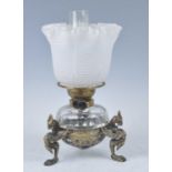 A Victorian brass oil lamp, having a white and frosted Verre Moire silk glass shade above a cut