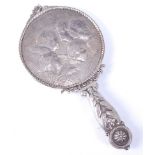 A Victorian silver hand mirror, having a circular bevelled mirrorplate, the reverse repousse