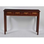 A mahogany apothecary side table, in the Georgian style, having four annotated frieze drawers,