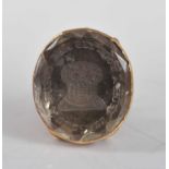 An early 19th Century yellow metal fob seal, set with an oval intaglio rock crystal engraved with
